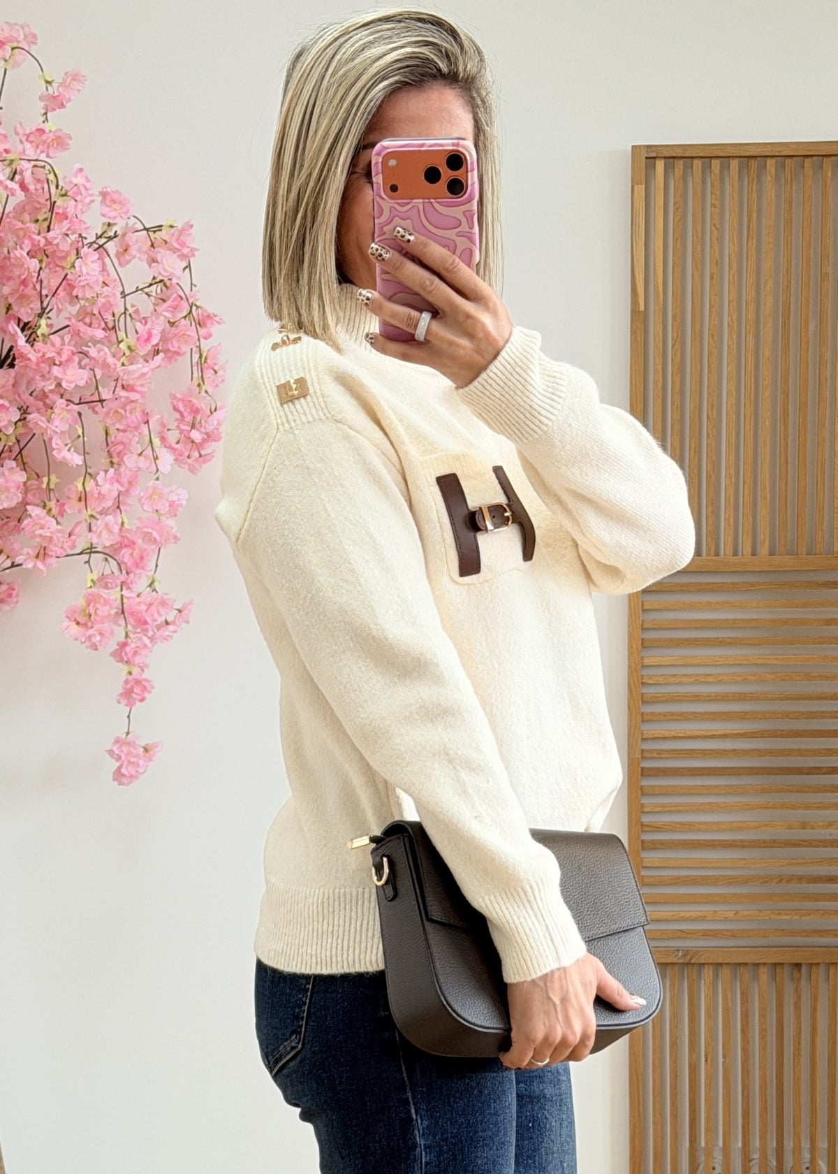 Pull col montant avec poche en simili cuir