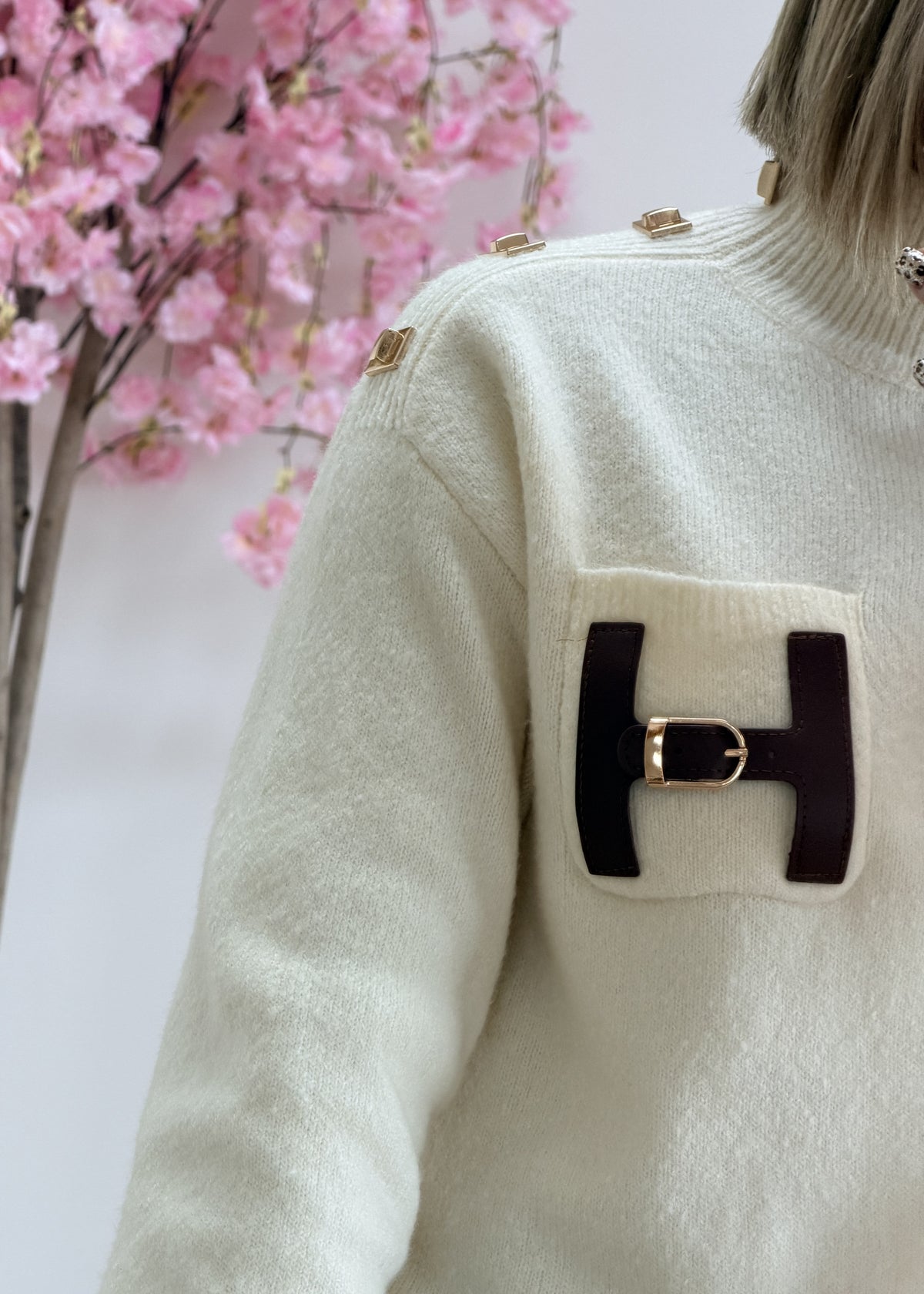 Pull col montant avec poche en simili cuir